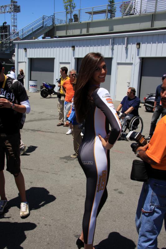 M09_4884.jpg - BMR Geico Buell racing umbrella girl. The body stockings were in vogue this year.